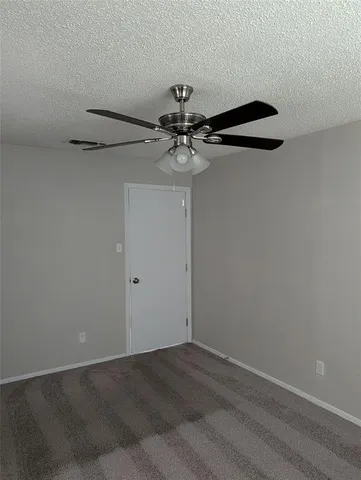 a bath room with a toilet and a bath tub