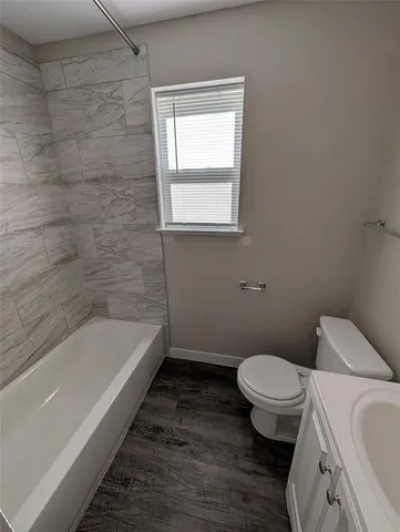 a bathroom with a shower and a toilet