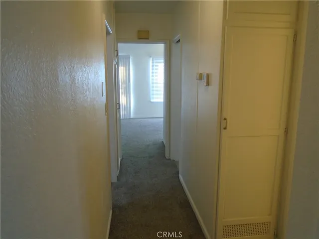 a view of a bathroom from a hallway