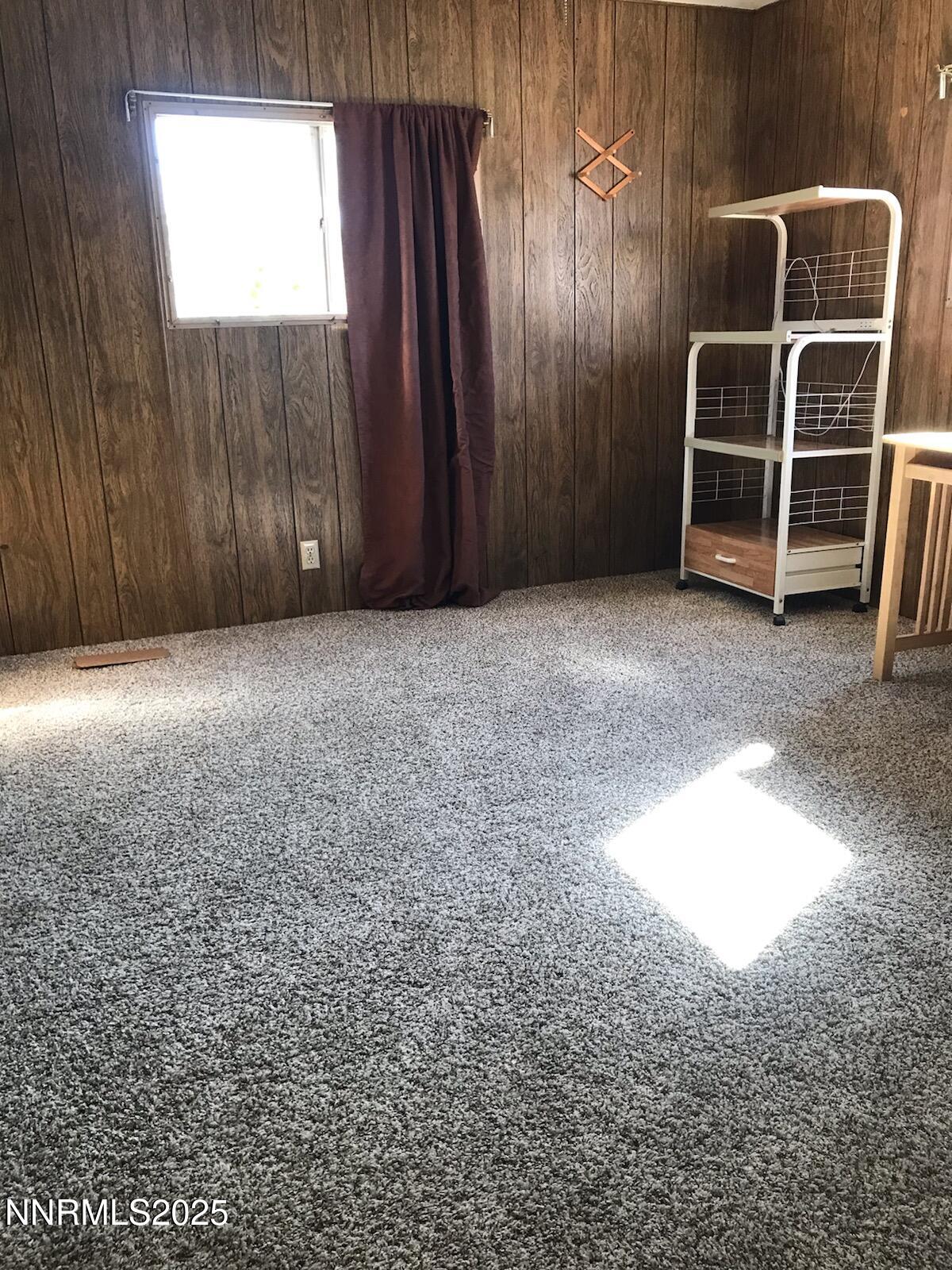 3791 Granite Way Topaz Ranch Estates, NV 89444 - Photo 21 of 39 an empty room with wooden floor and windows