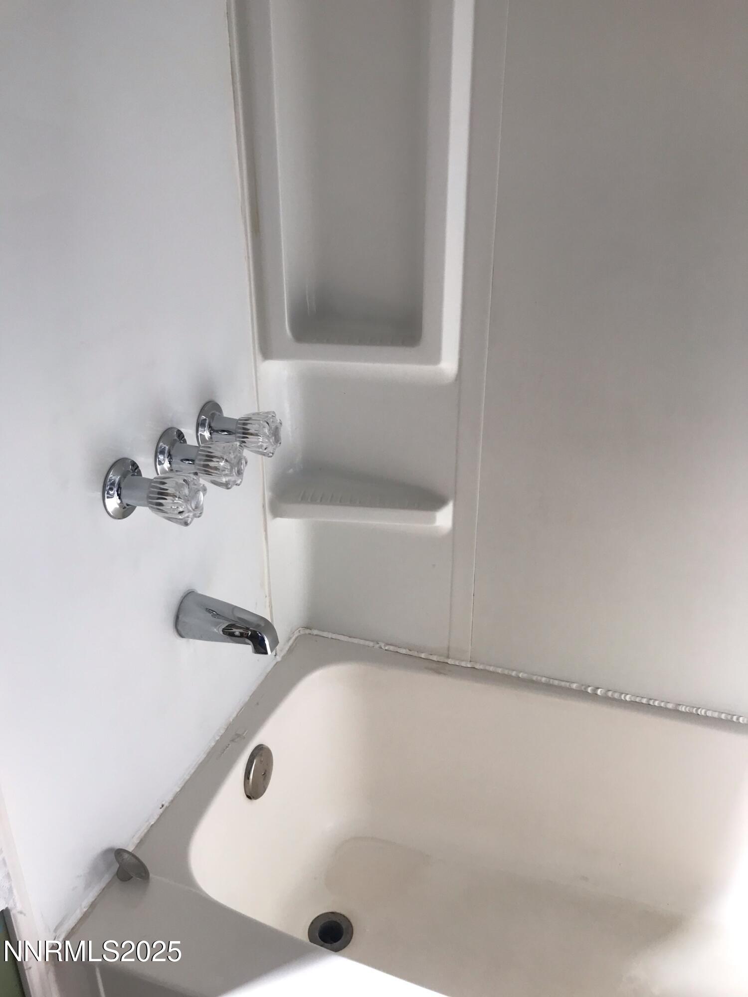 3791 Granite Way Topaz Ranch Estates, NV 89444 - Photo 24 of 39 a bathroom with a tub