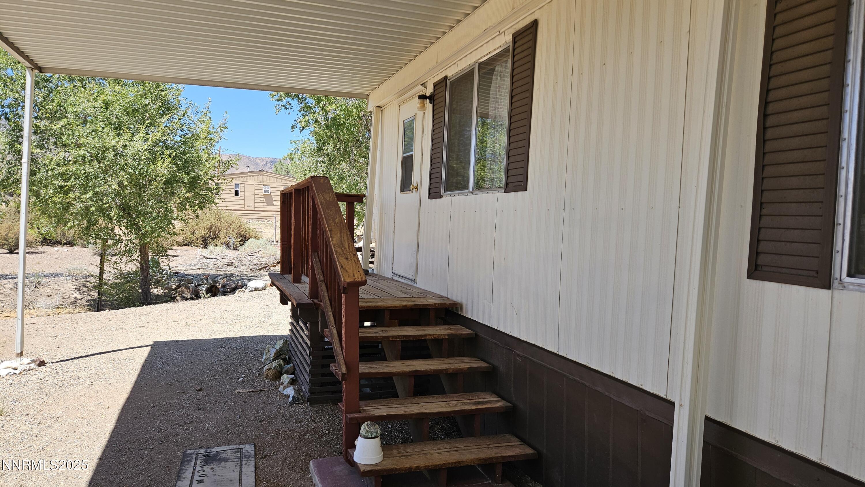 3791 Granite Way Topaz Ranch Estates, NV 89444 - Photo 34 of 39 a view of entryway with wooden floor and a rug