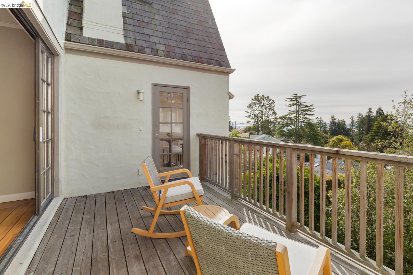 22 Windsor Avenue Kensington, CA 94708 - Photo 12 of 30 a balcony with wooden floor table and chairs