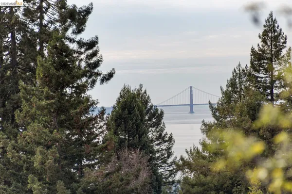a view of a dining room with furniture and a window