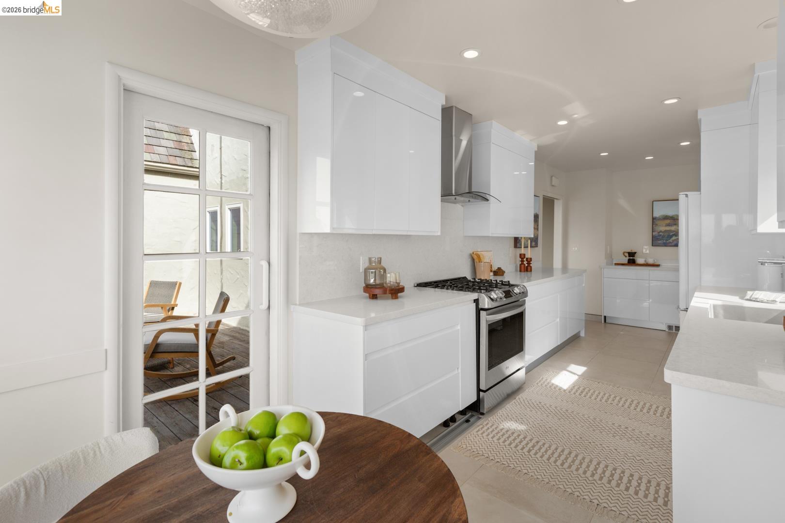 22 Windsor Avenue Kensington, CA 94708 - Photo 18 of 30 a kitchen with stainless steel appliances kitchen island granite countertop a sink and cabinets