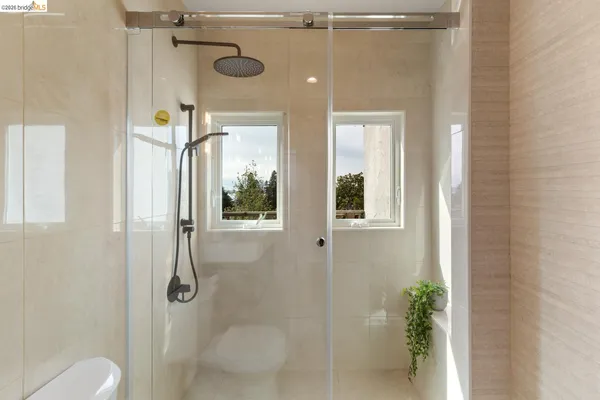 a bathroom with a sink vanity and mirror