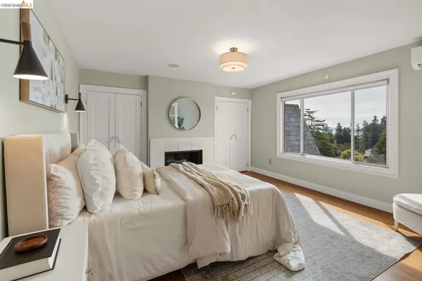 a room with a fireplace and a mirror