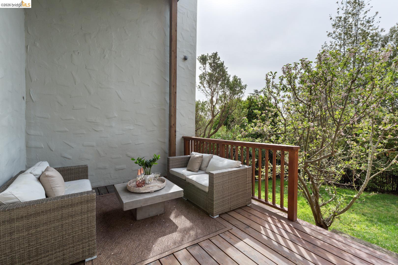 22 Windsor Avenue Kensington, CA 94708 - Photo 28 of 30 a balcony with couches and a potted plant on a table