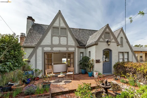 a front view of a house with garden