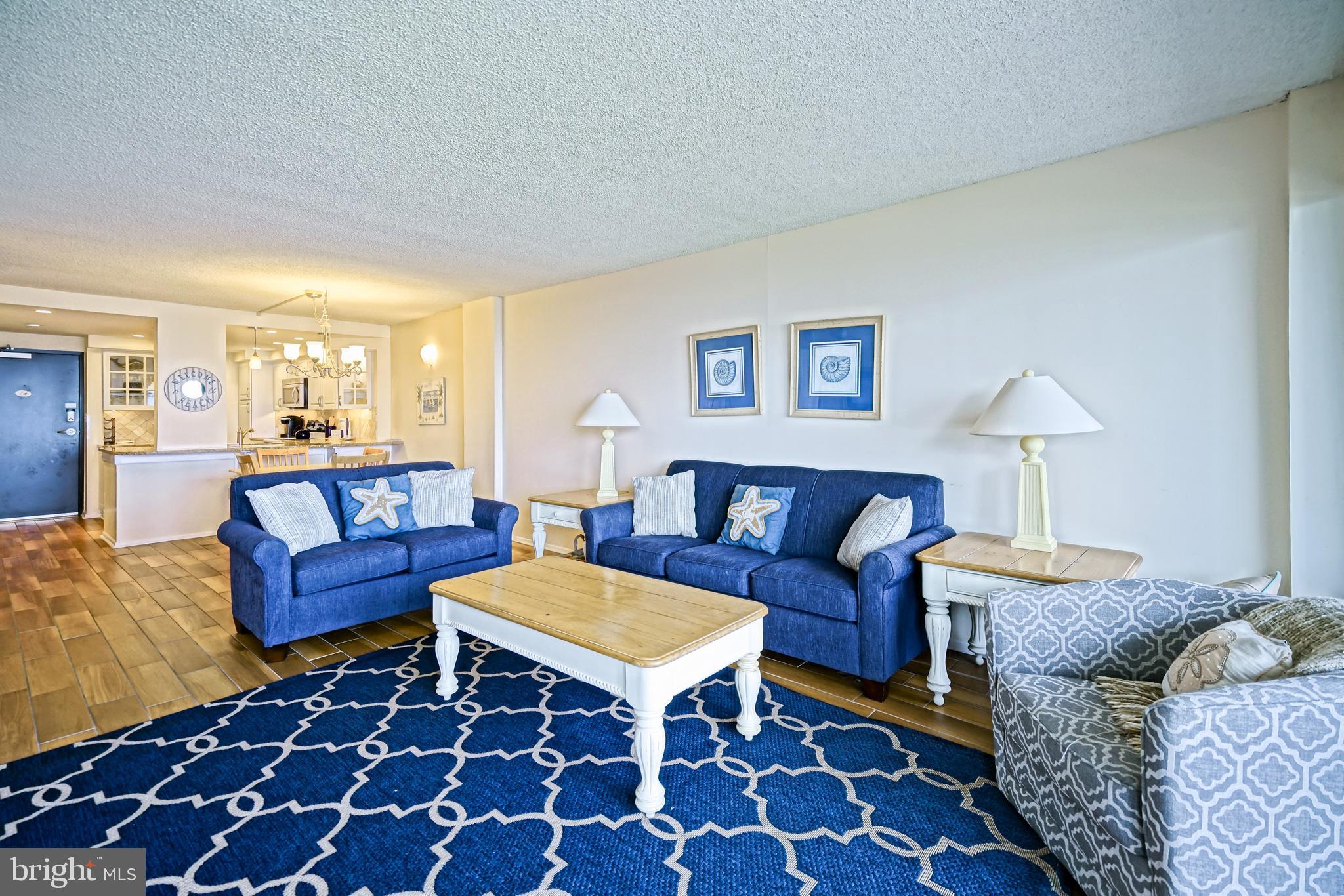 604 Dover House Road, Unit 604S Bethany Beach, DE 19930 - Photo 12 of 43 a living room with furniture and a rug