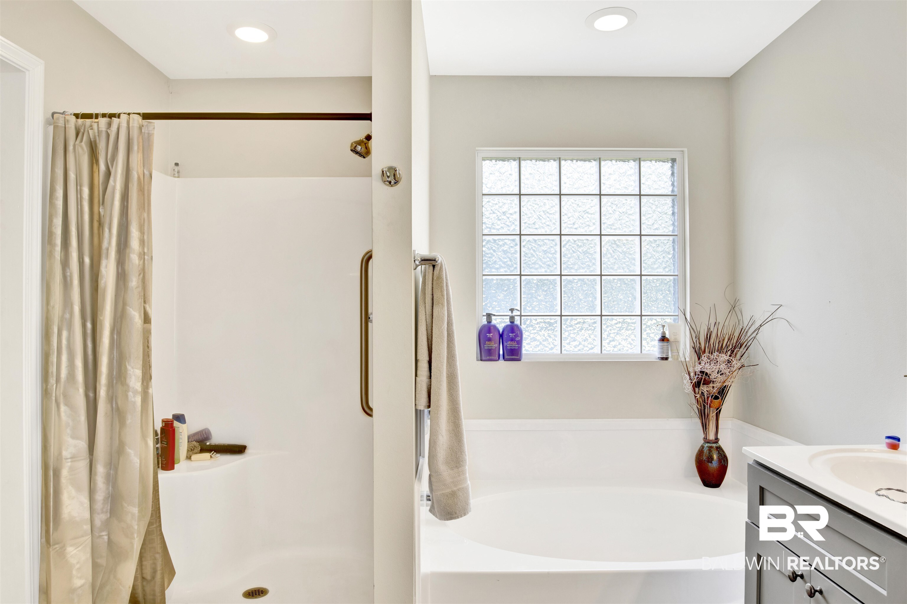 24384 Sailfish Lane Orange Beach, AL 36561 - Photo 16 of 23 Bathroom with shower with separate bathtub and vanity