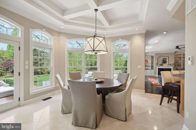 a view of a workspace with furniture and a kitchen