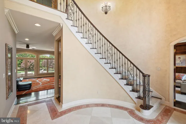 a bedroom with a bed a dresser and flat screen tv