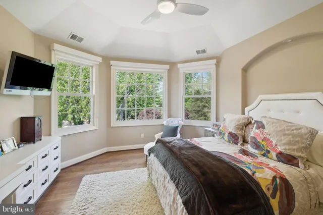 a bedroom with two beds and white walls
