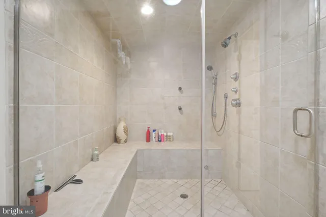 a view of balcony with wooden floor and fence
