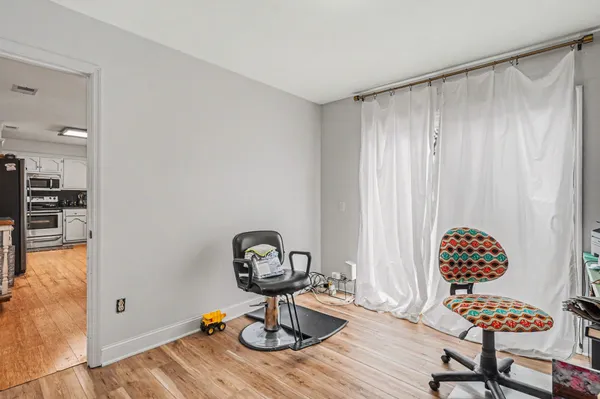 a room with furniture and a flat screen tv