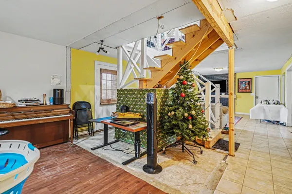 a living room filled with furniture and a table