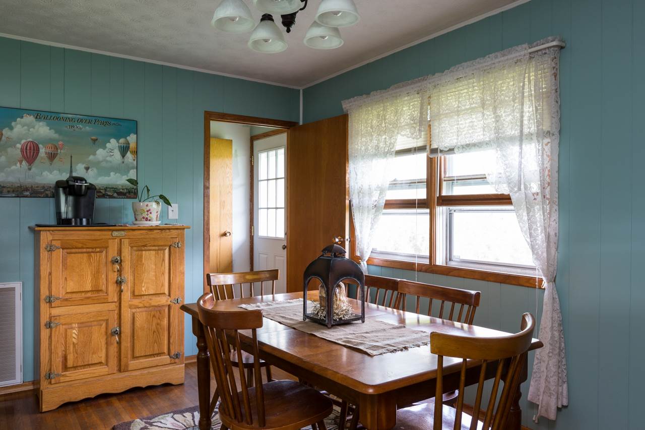 2439 Fairview Road Mount Crawford, VA 22841 - Photo 4 of 27 The dining room features hardwood floors and a large window that allows for nice natural light into the space.