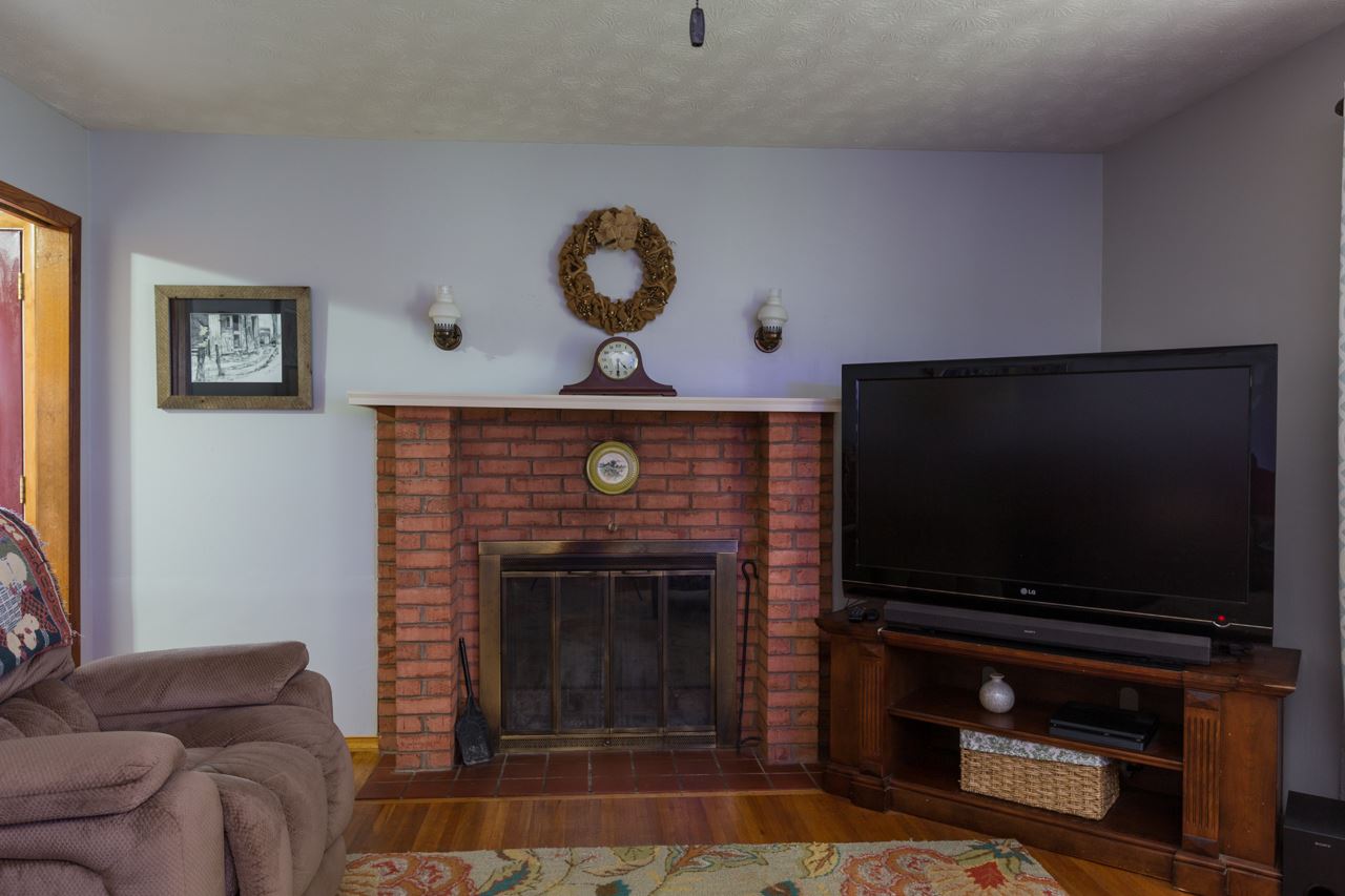2439 Fairview Road Mount Crawford, VA 22841 - Photo 8 of 27 A closer look at the wood-burning fireplace with brick surround in the living room.
