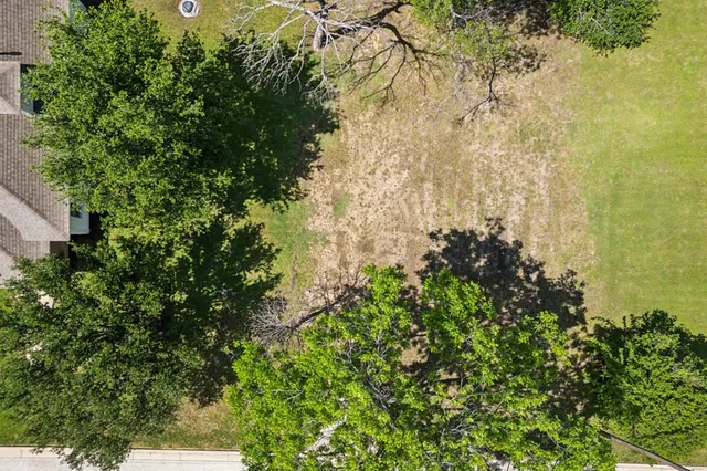 an aerial view of house with yard swimming pool and outdoor seating