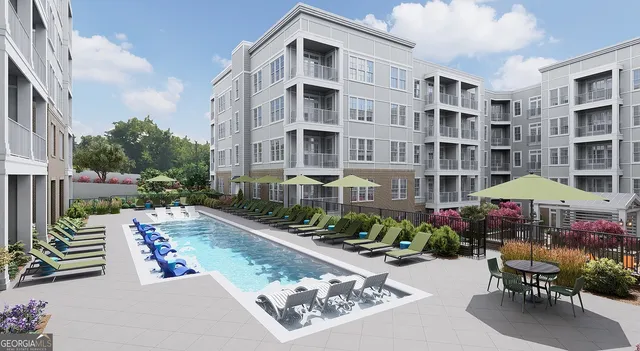 a front view of a house with yard and sitting area