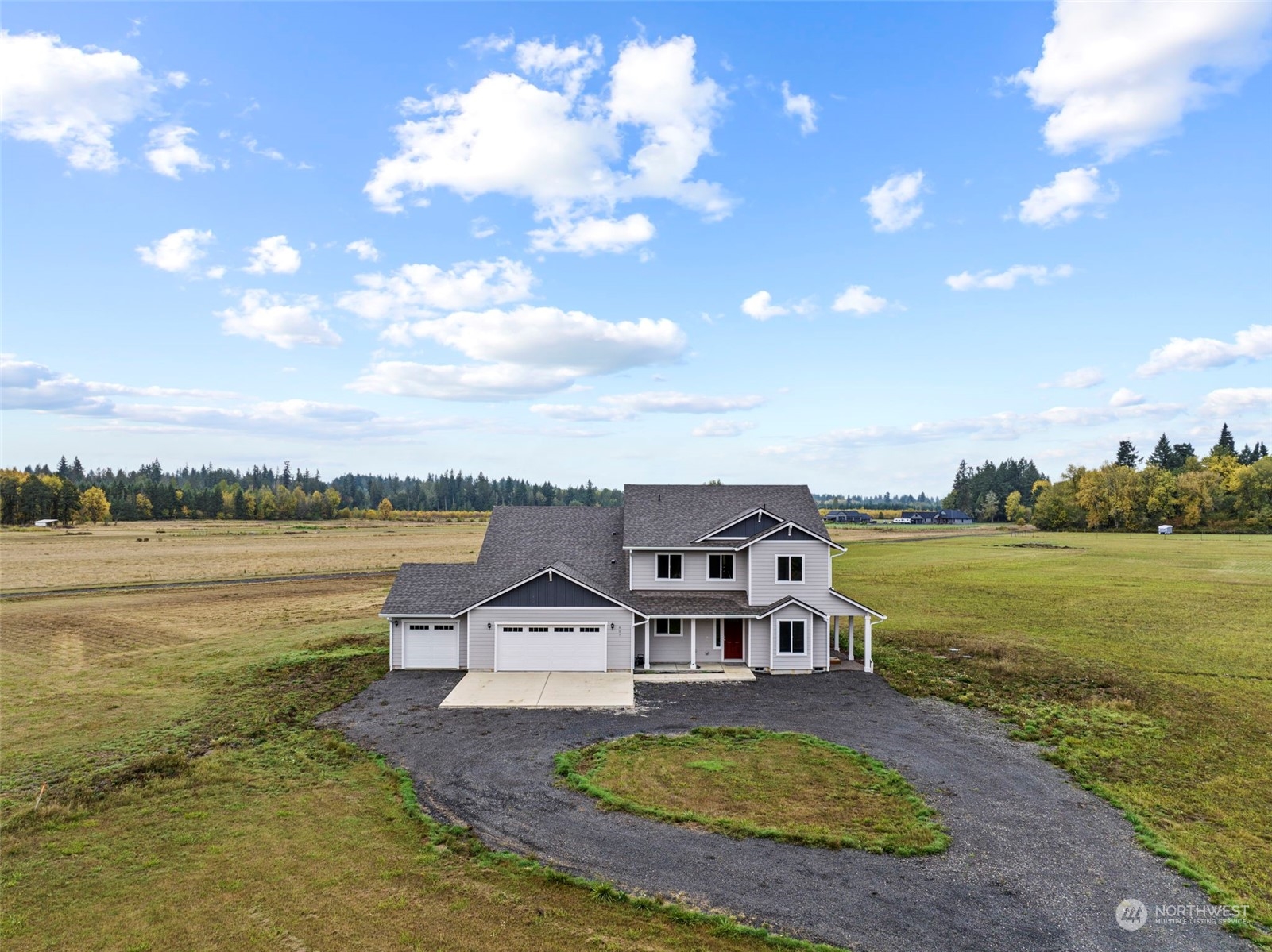 607 Tauscher Road Chehalis, WA 98532 - Photo 1 of 25 a view of a lake with a big yard and a large tree