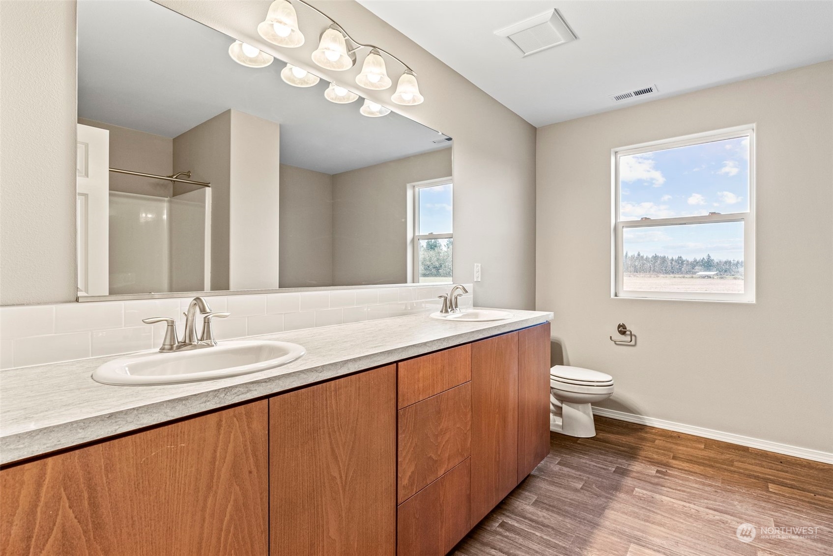 607 Tauscher Road Chehalis, WA 98532 - Photo 17 of 25 a bathroom with a sink a toilet and a mirror
