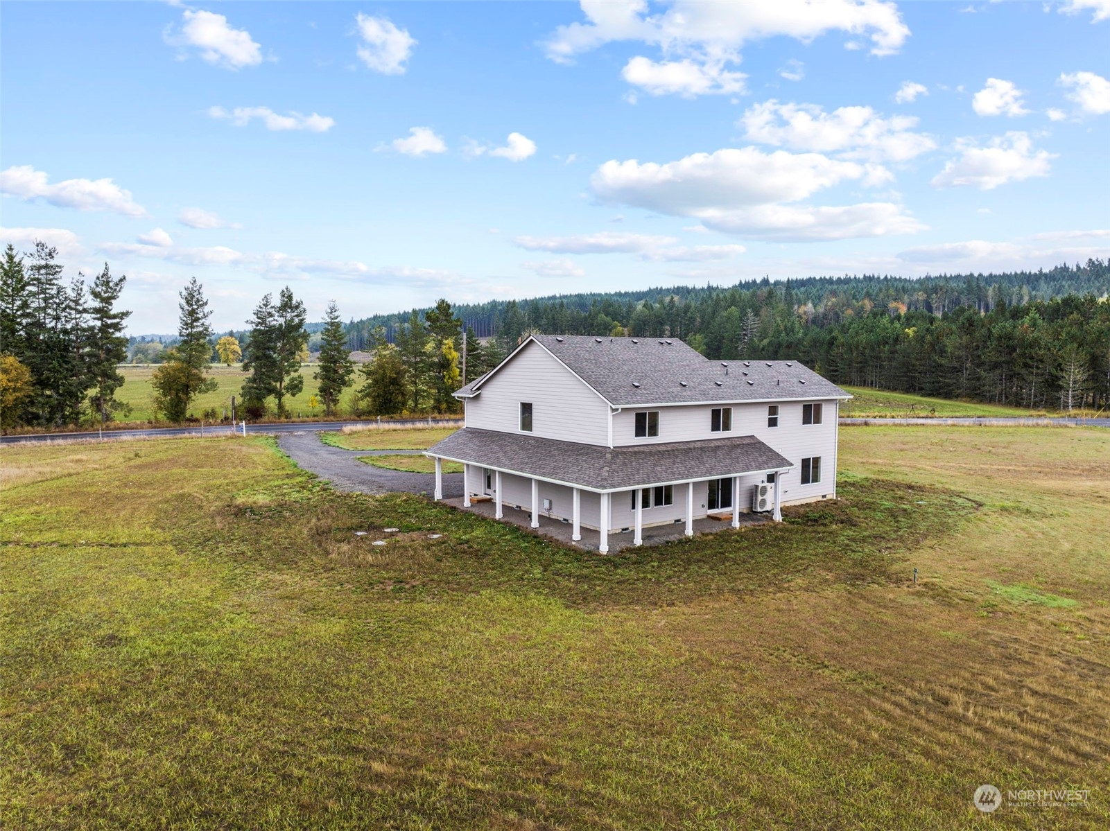 607 Tauscher Road Chehalis, WA 98532 - Photo 20 of 25 a view of a house with a big yard and large trees