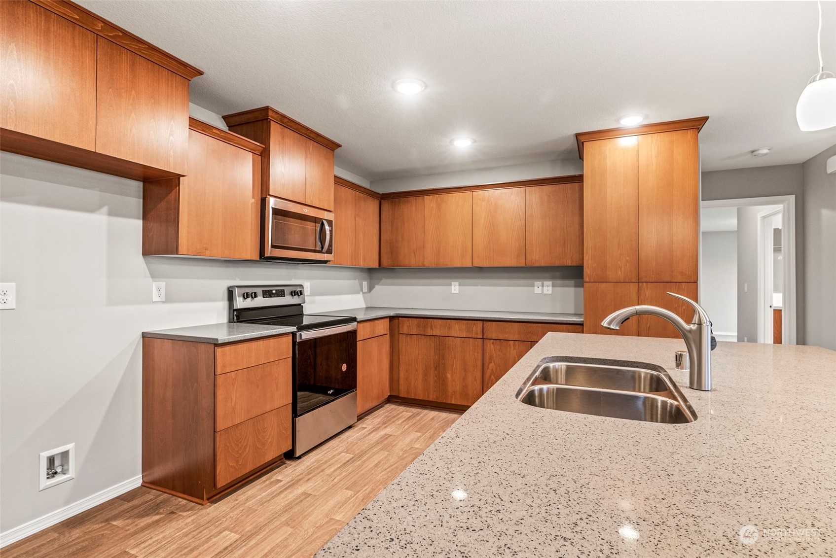 607 Tauscher Road Chehalis, WA 98532 - Photo 6 of 25 a kitchen with stainless steel appliances granite countertop a stove a sink and a microwave