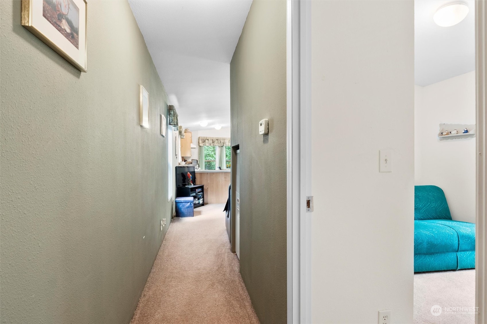 8351 Custer School Road Custer, WA 98240 - Photo 18 of 38 a view of a hallway with a livingroom and a chair