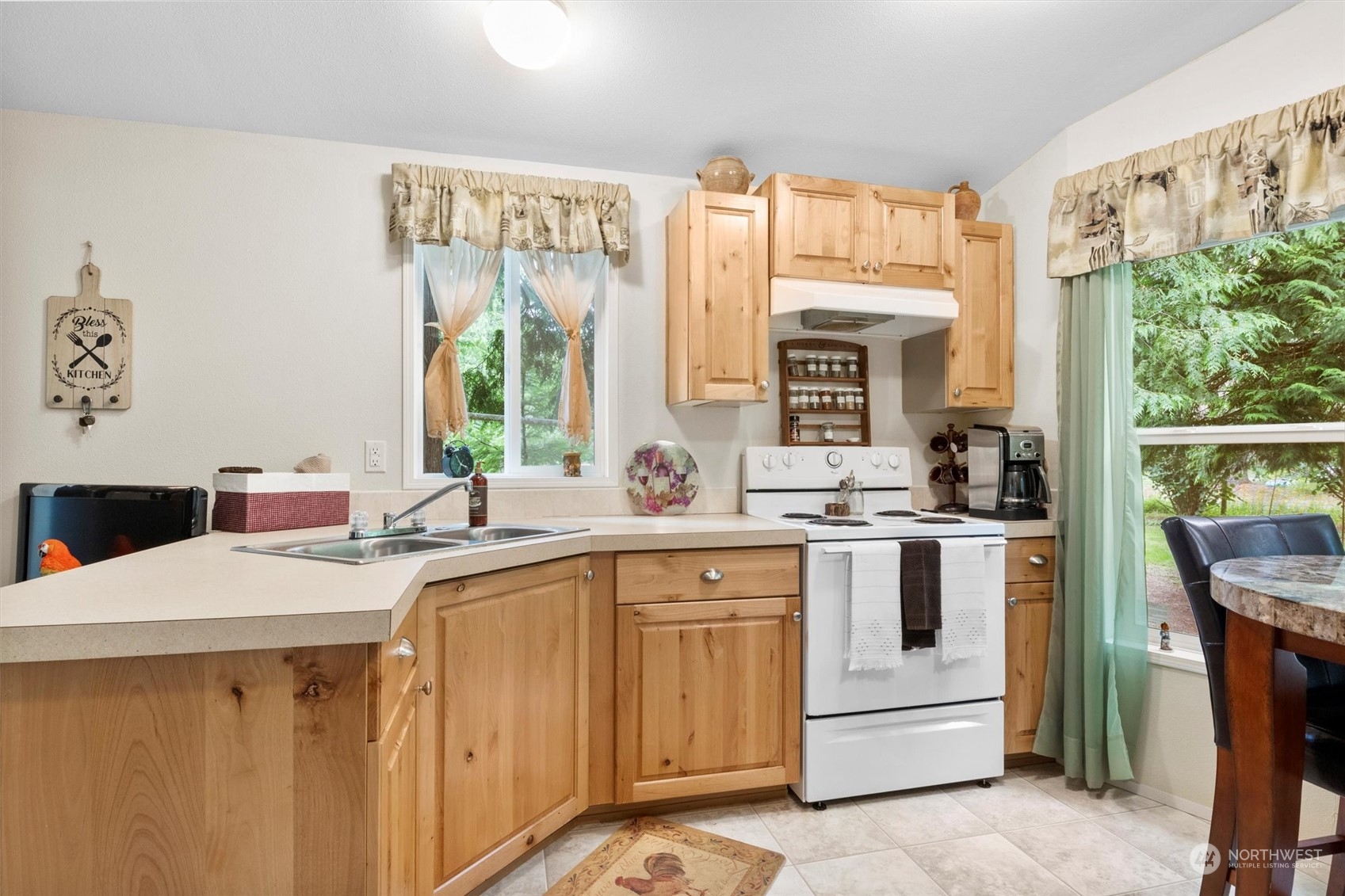 8351 Custer School Road Custer, WA 98240 - Photo 22 of 38 a kitchen with a sink stove and cabinets