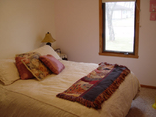 5863 Rural Edge Drive Roscoe, IL 61073 - Photo 10 of 11 a bedroom with a bed and a window