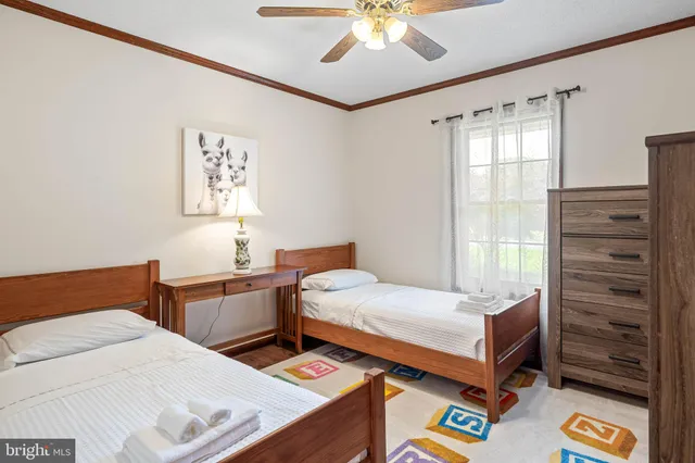 a bedroom with a bed and a dresser