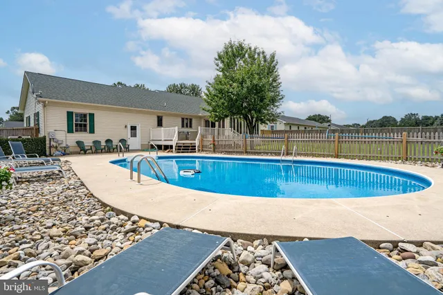 a view of a swimming pool with a patio
