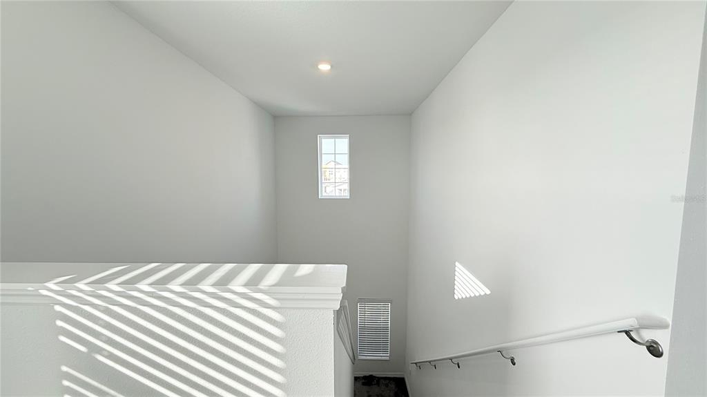 1179 Tyler Loop Lake Wales, FL 33859 - Photo 11 of 25 a bedroom with a bed and a window