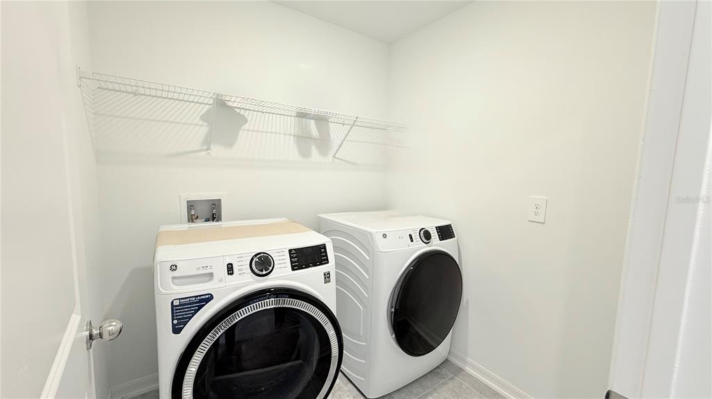 1179 Tyler Loop Lake Wales, FL 33859 - Photo 16 of 25 a view of storage and utility room with washer and dryer