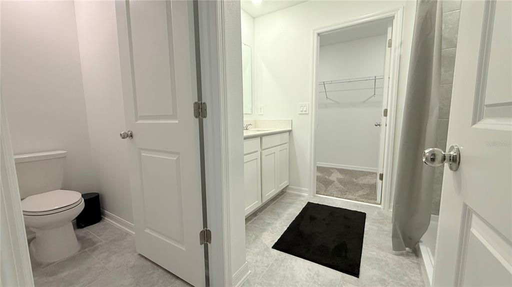 1179 Tyler Loop Lake Wales, FL 33859 - Photo 19 of 25 a bathroom with a sink and a toilet