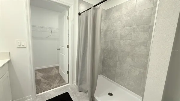 a bathroom with a tub and shower