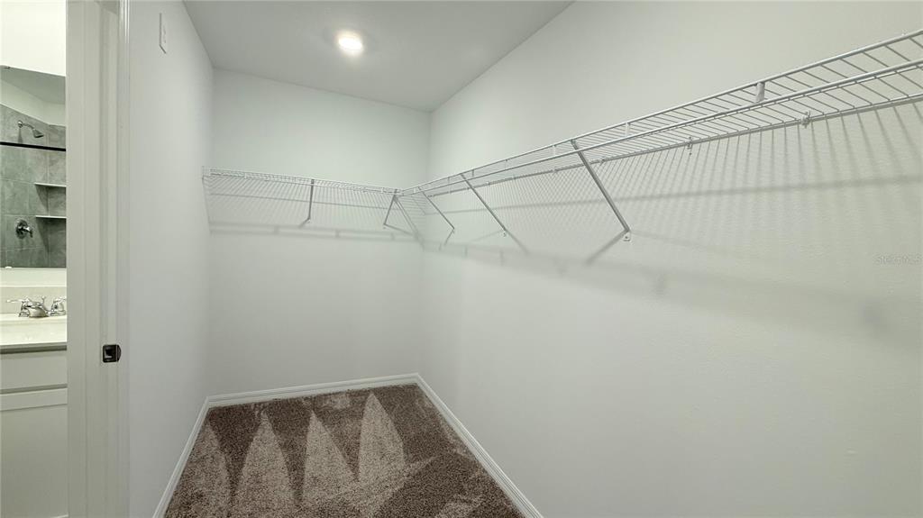 1179 Tyler Loop Lake Wales, FL 33859 - Photo 22 of 25 a view of a room with racks on the wall