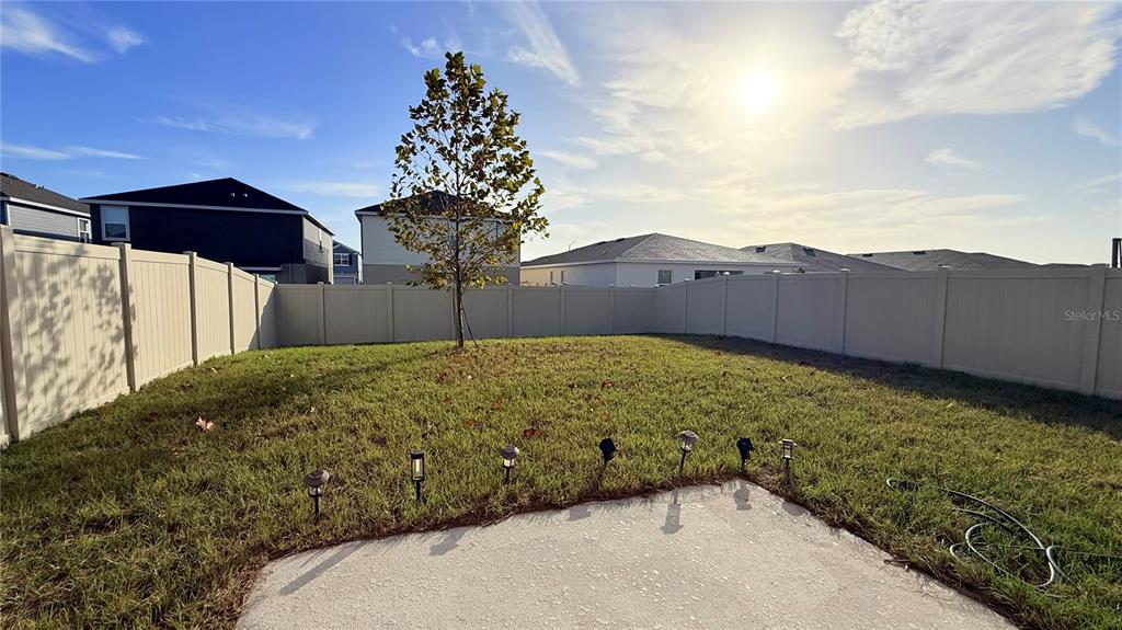 1179 Tyler Loop Lake Wales, FL 33859 - Photo 24 of 25 a view of a backyard with a garden