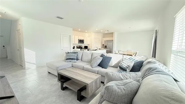 a living room with furniture and a couch