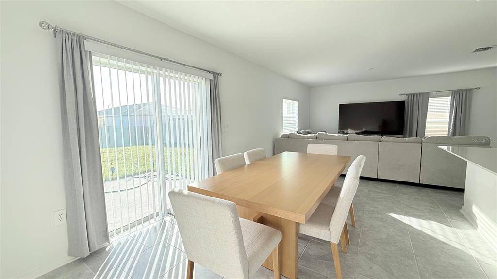 1179 Tyler Loop Lake Wales, FL 33859 - Photo 9 of 25 a living room with furniture and a flat screen tv