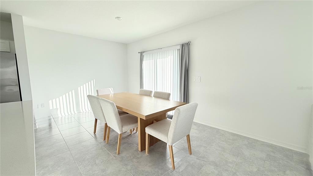 1179 Tyler Loop Lake Wales, FL 33859 - Photo 10 of 25 a view of a dining room with furniture
