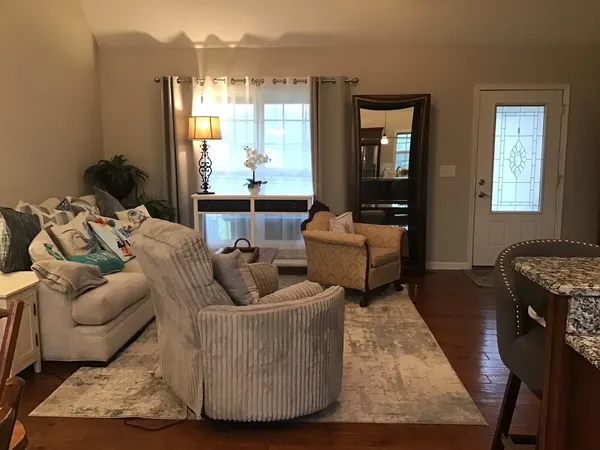a living room with furniture and a large window