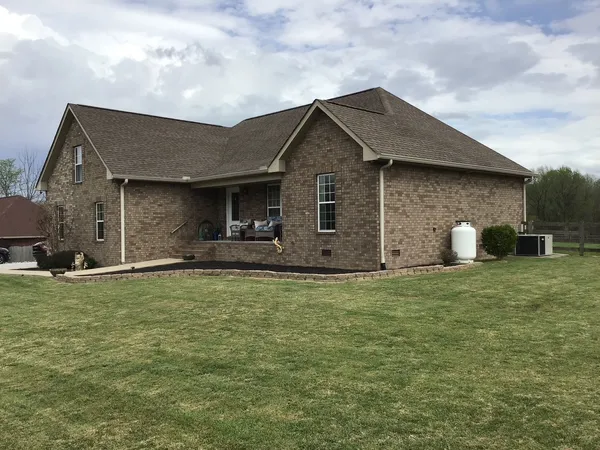 a front view of a house with a yard