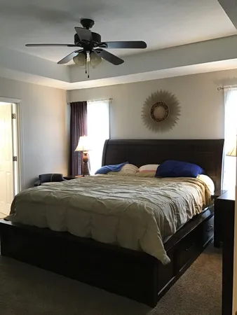 a bedroom with a bed and window