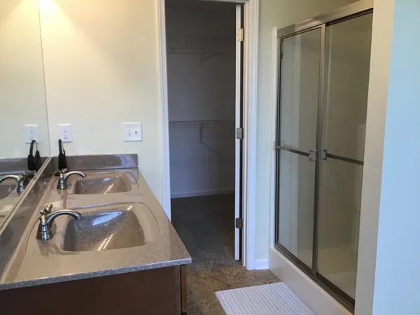 a bathroom with a sink and mirror