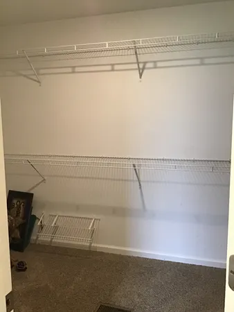 a view of a room with racks on the wall