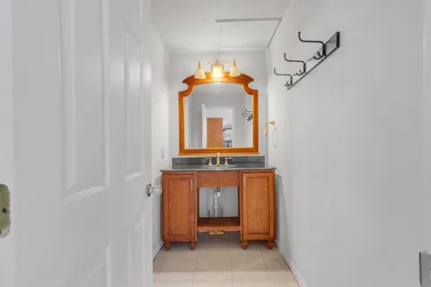 a front view of a house with a window and a mirror