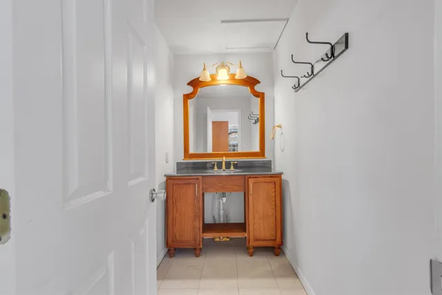 a front view of a house with a window and a mirror